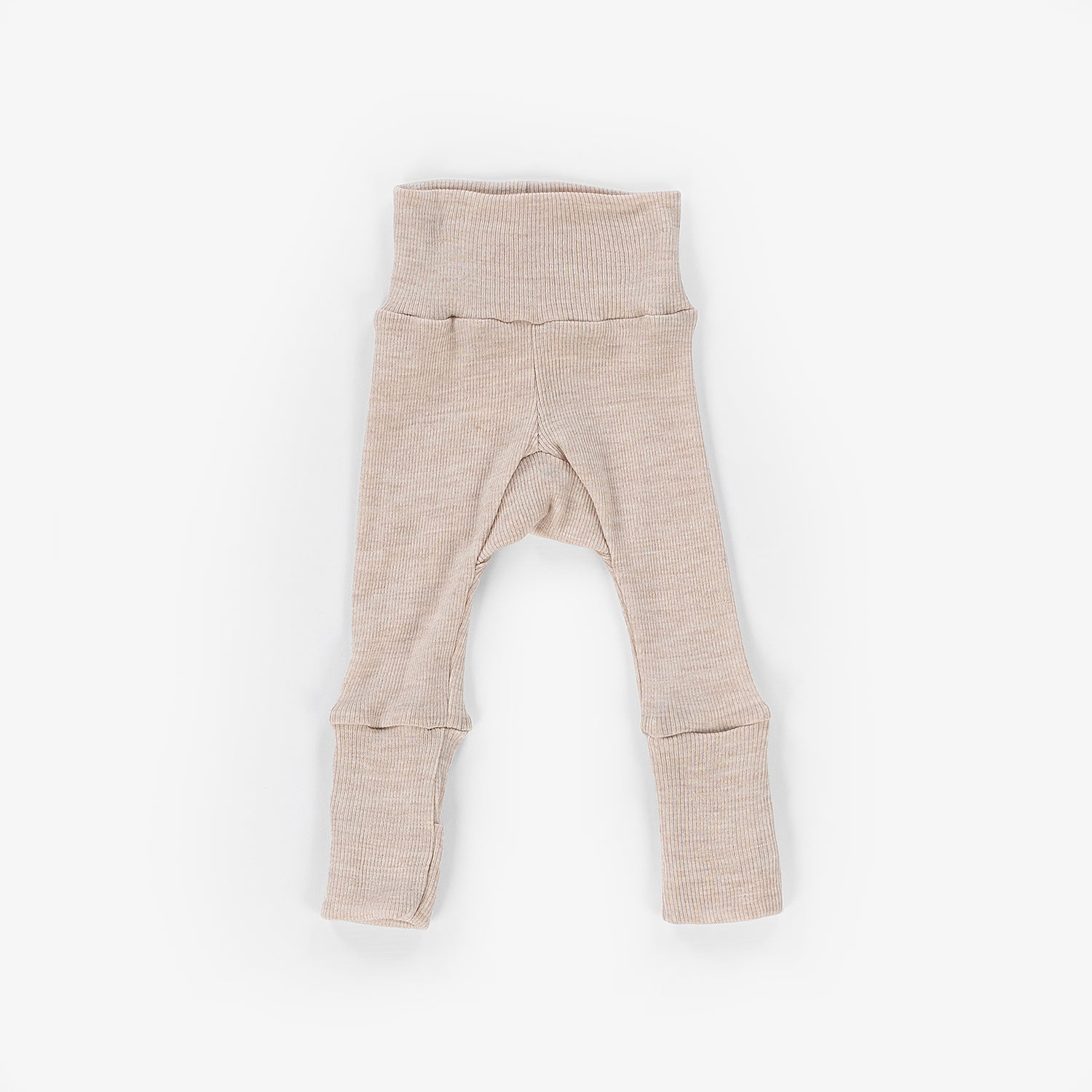 Wollen baby leggings met voetjes tegen een witte achtergrond